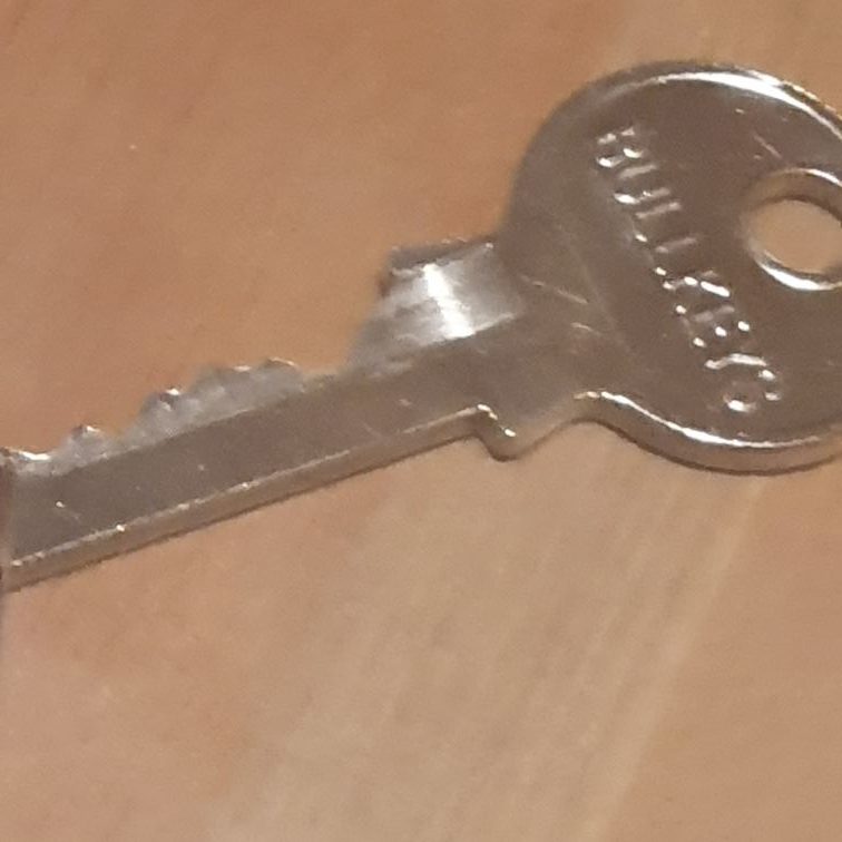 A silver key with Locksmith Fishponds
